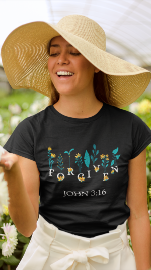 forgiven_2_mockup-of-a-happy-girl-wearing-a-tshirt-and-a-sun-hat-in-a-greenhouse-22500